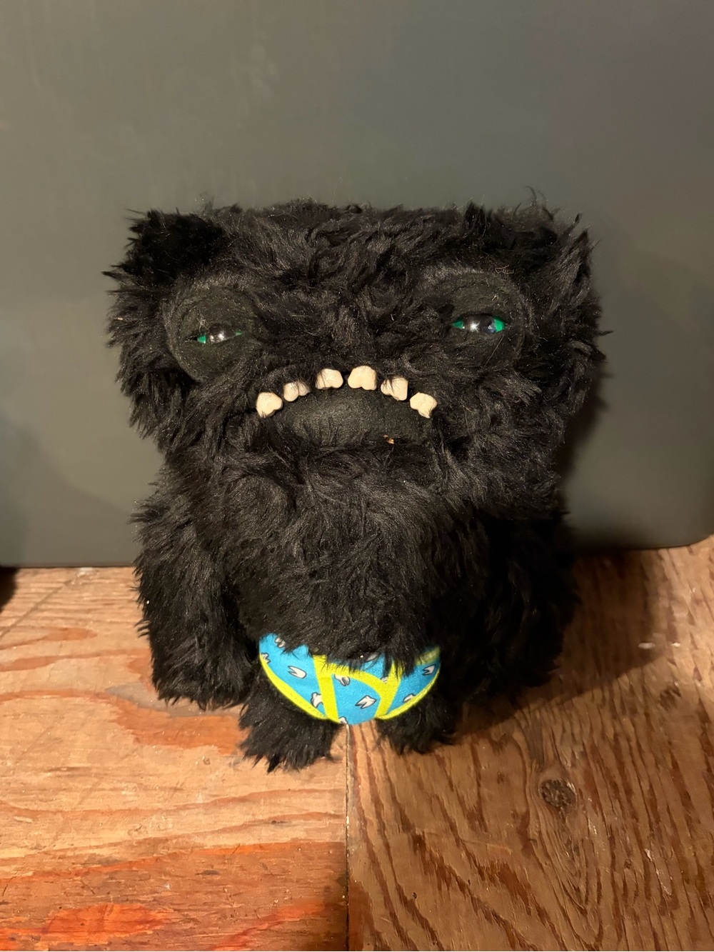 Black Fuzzy Monster Plush Toy with Blue Ball